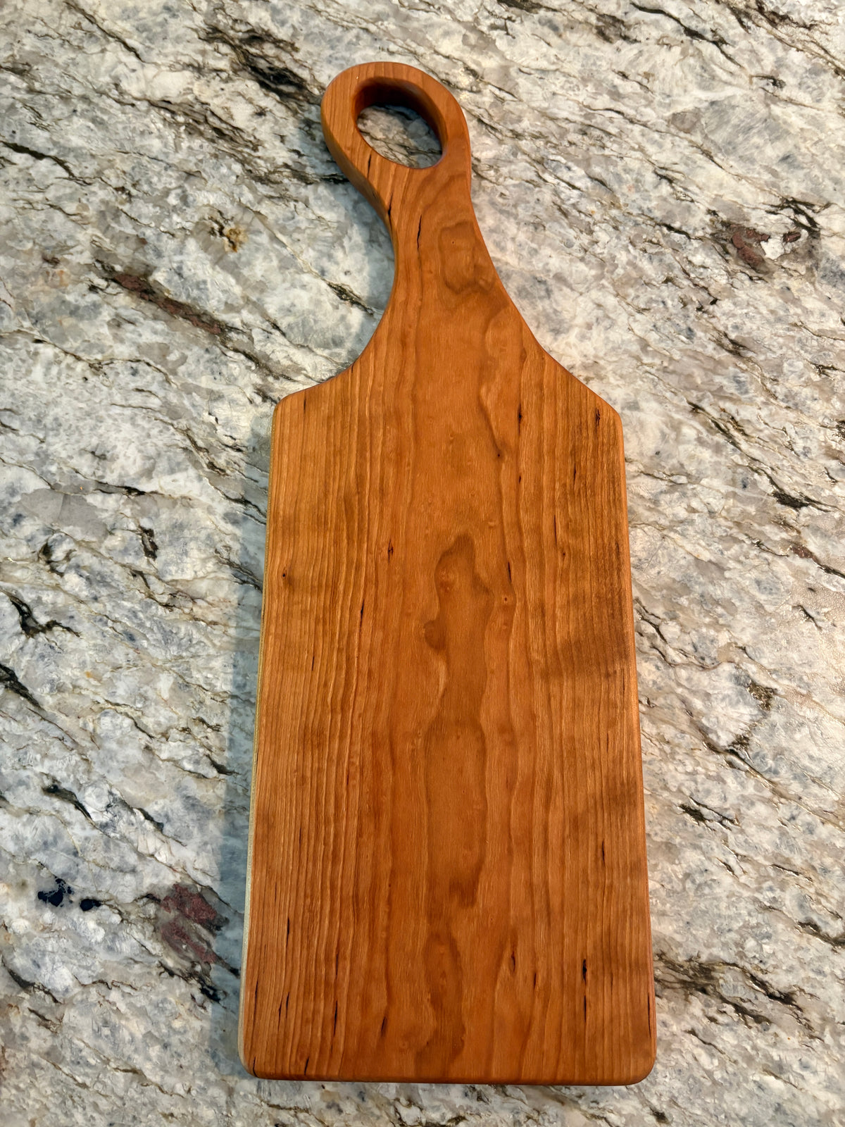 Classic Cherry charcuterie board with oval handle