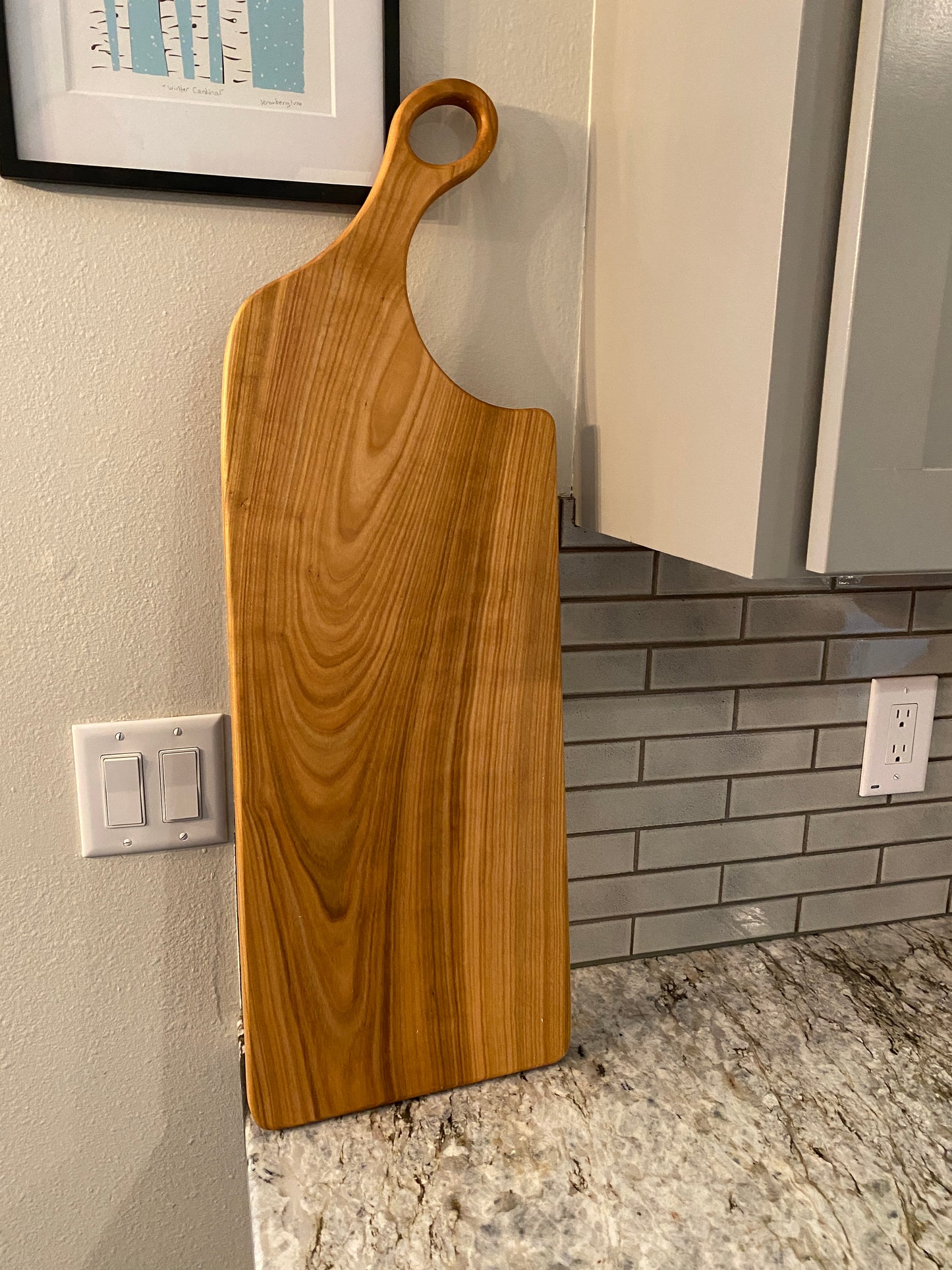 Classic cherry charcuterie board with oval handle