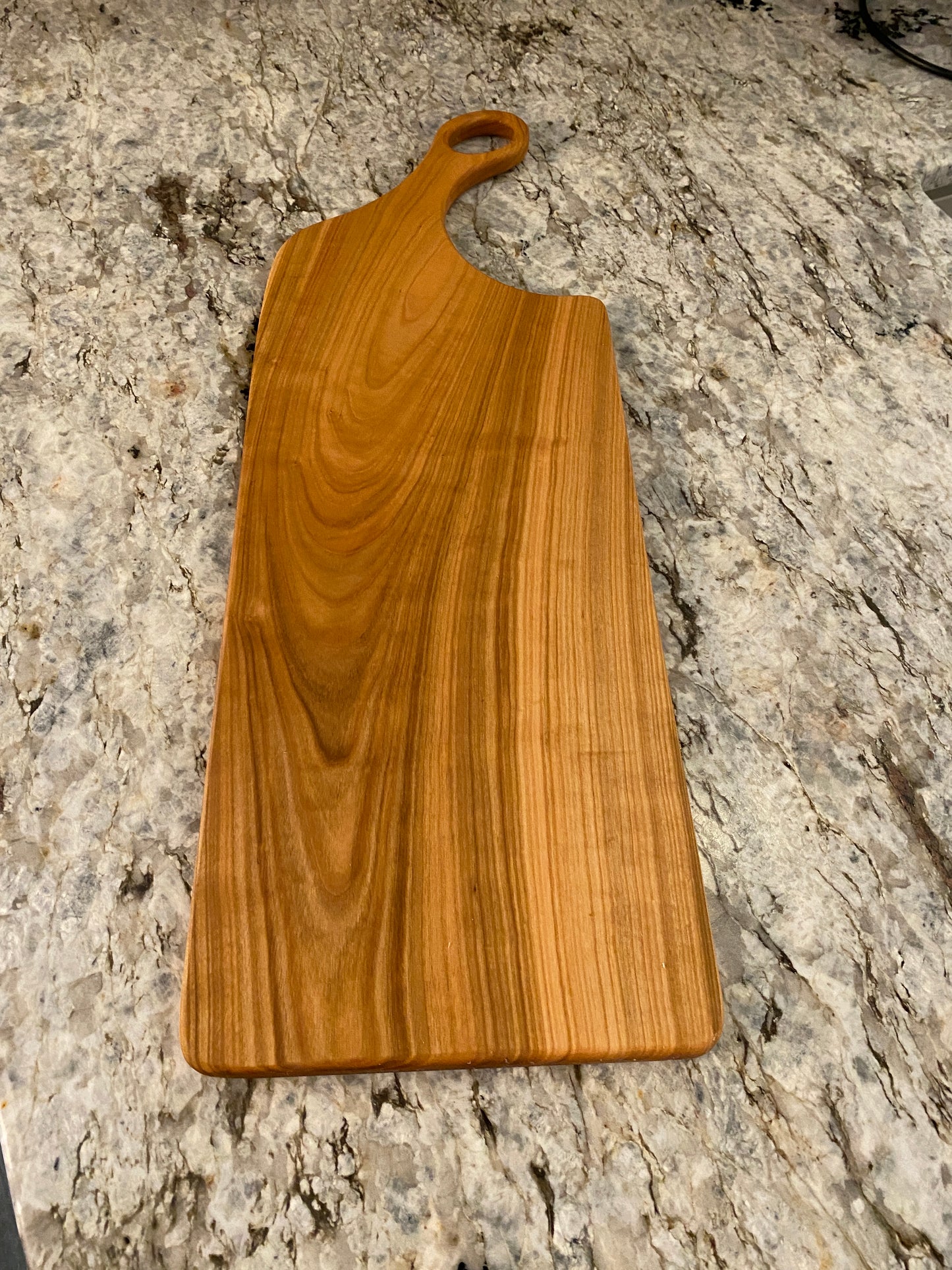 Classic cherry charcuterie board with oval handle