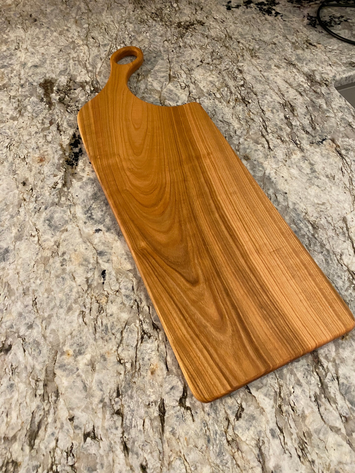 Classic cherry charcuterie board with oval handle