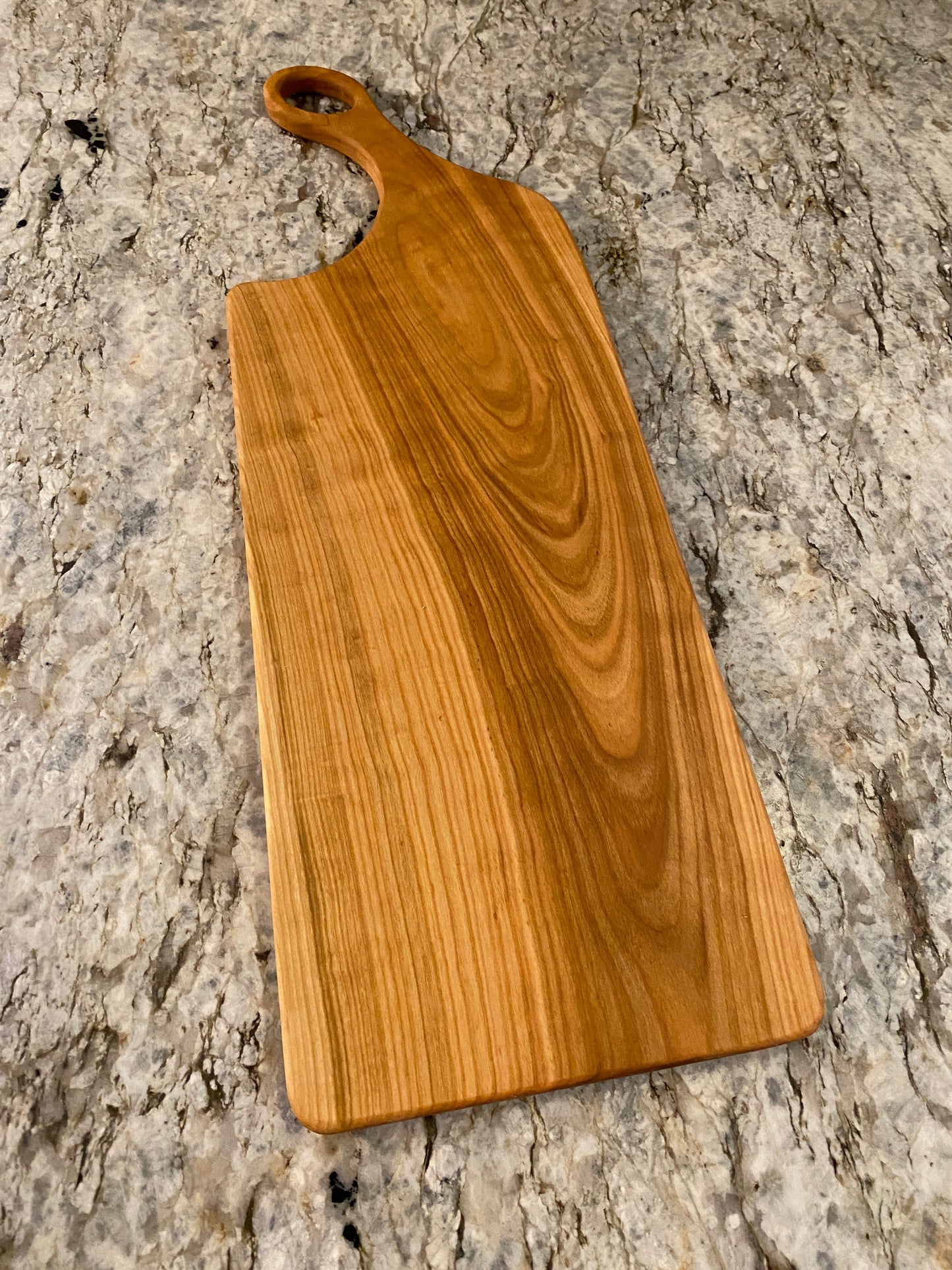 Classic cherry charcuterie board with oval handle