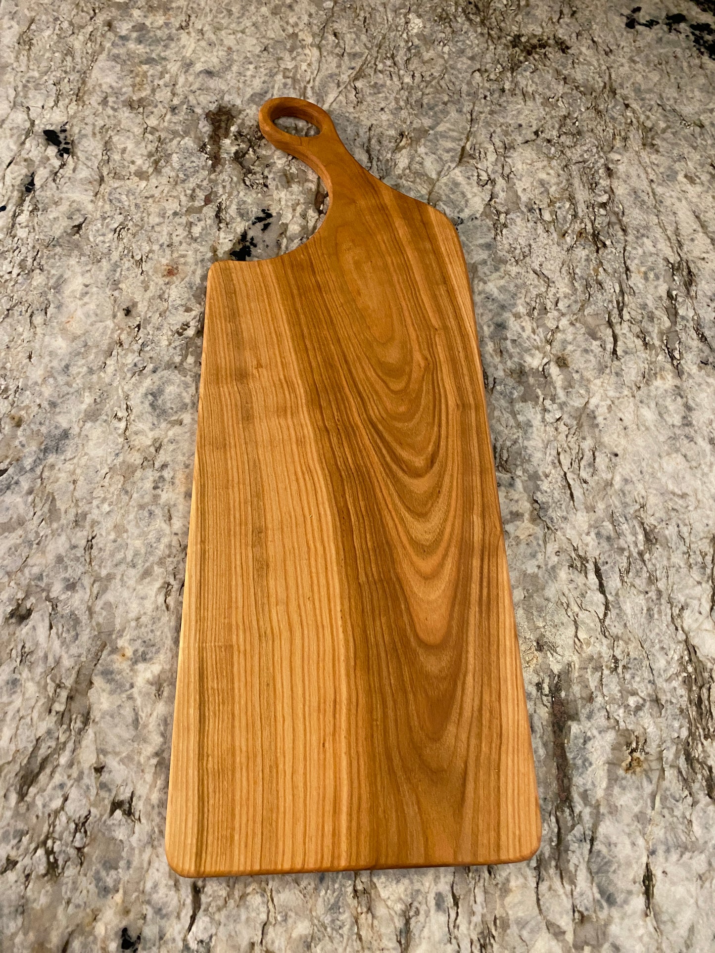 Classic cherry charcuterie board with oval handle