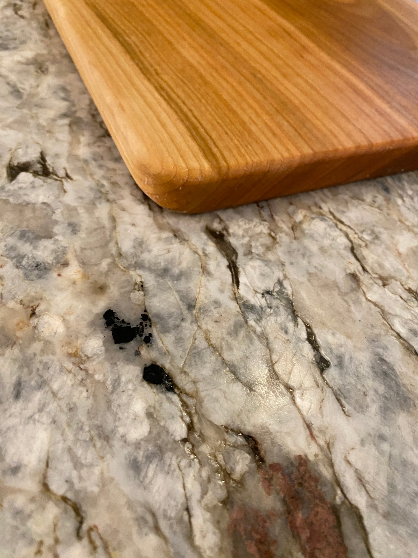 Classic cherry charcuterie board with oval handle