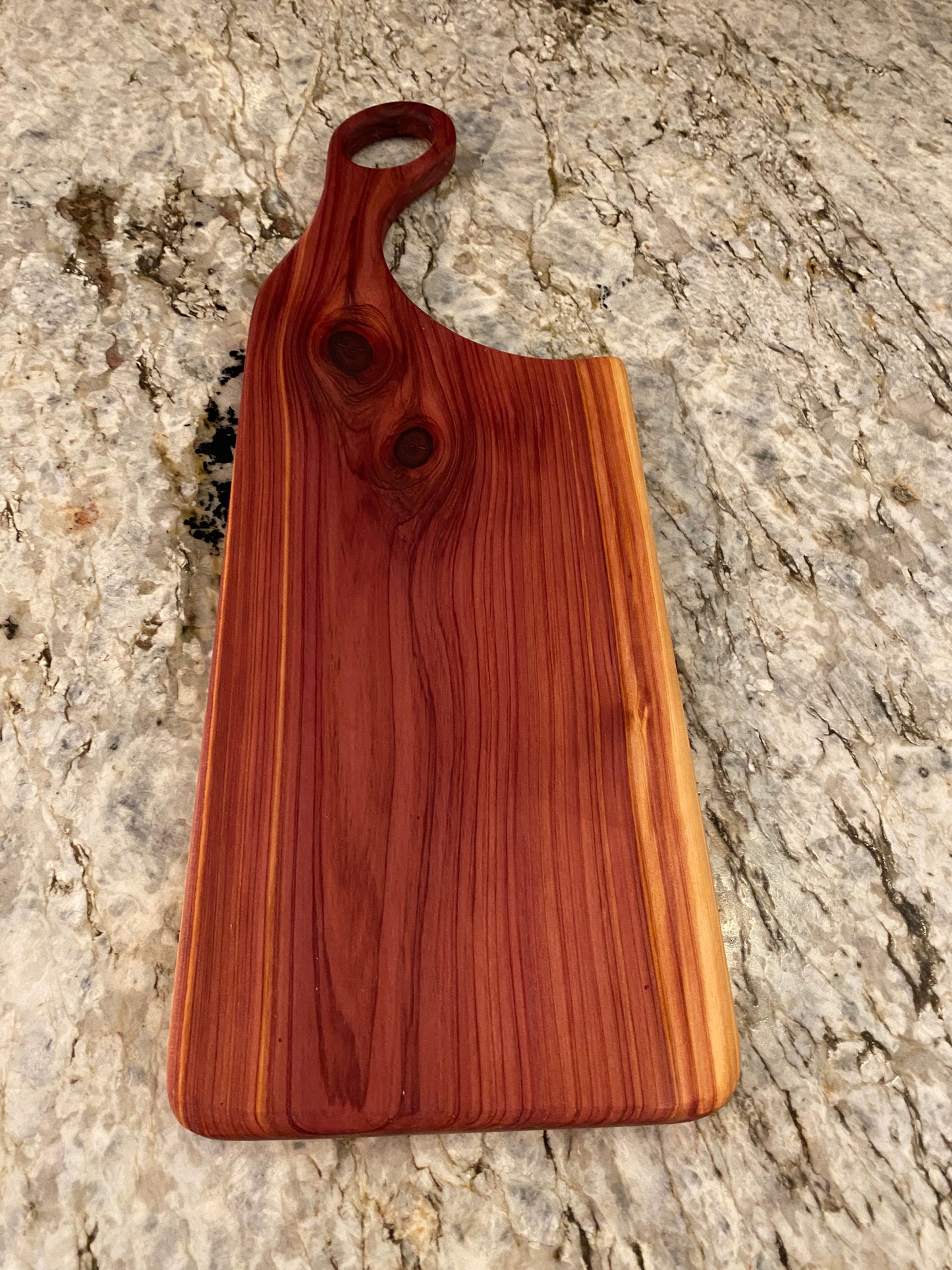 Classic aromatic cedar charcuterie board with oval handle