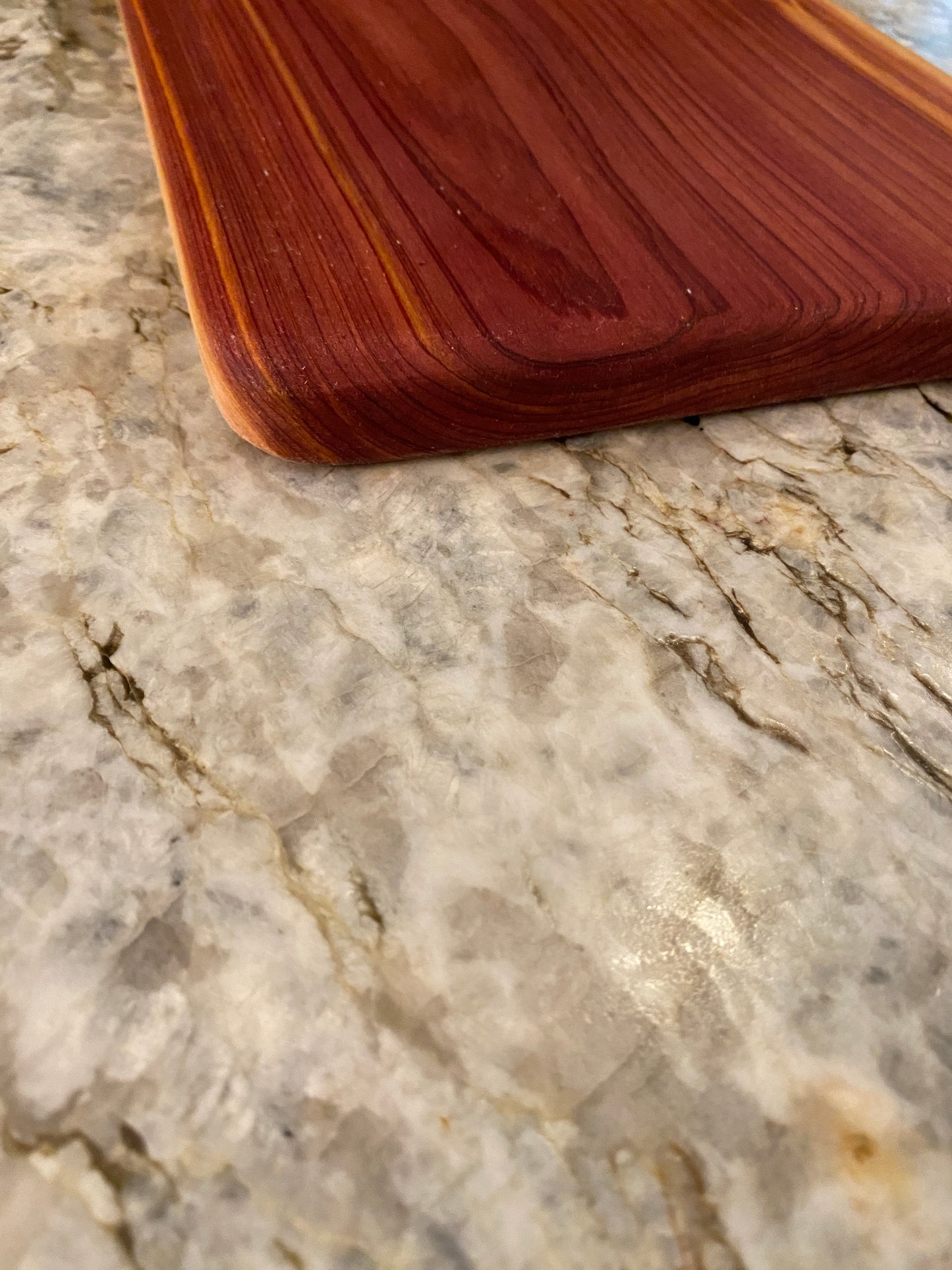 Classic aromatic cedar charcuterie board with oval handle