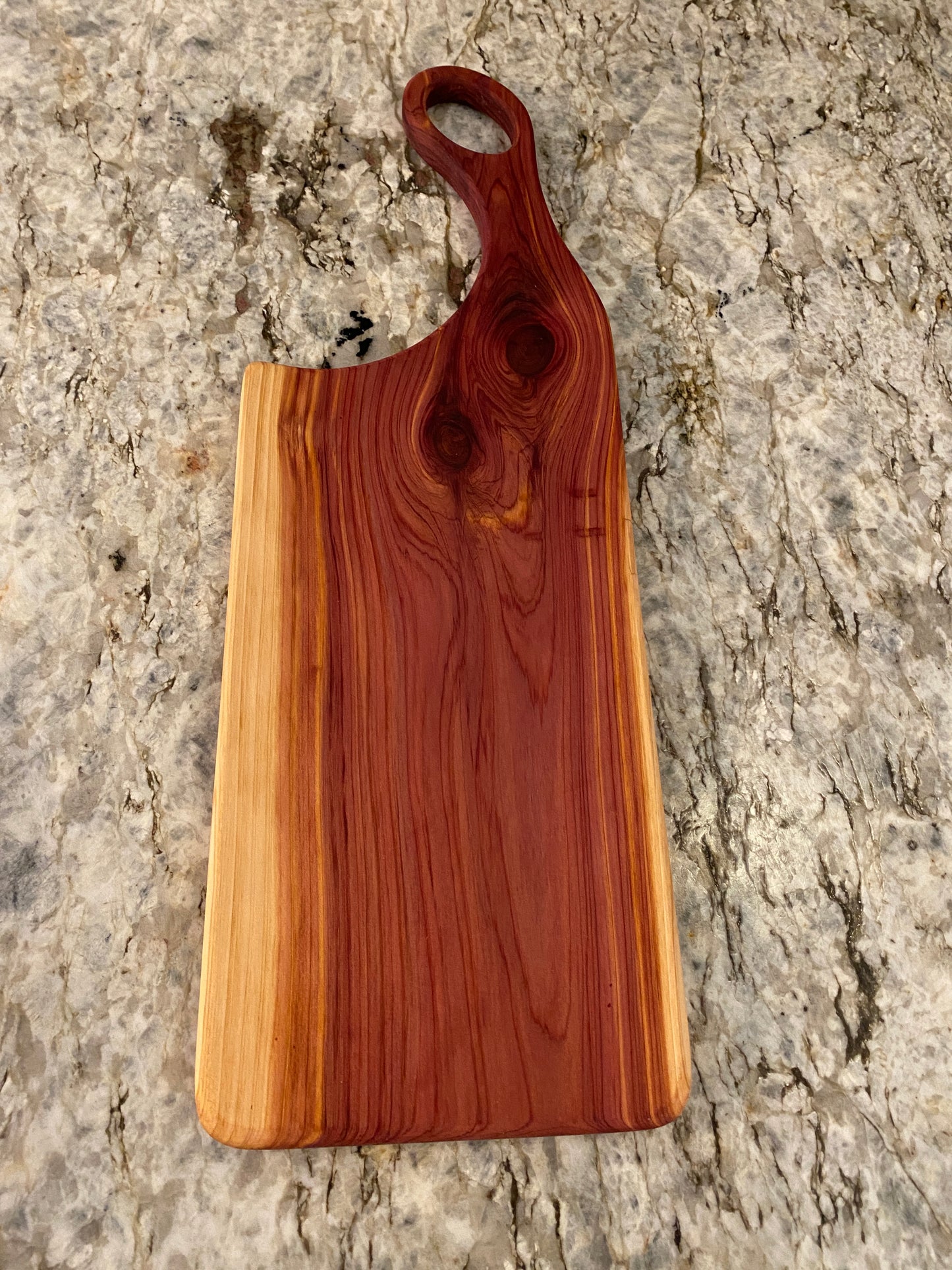 Classic aromatic cedar charcuterie board with oval handle