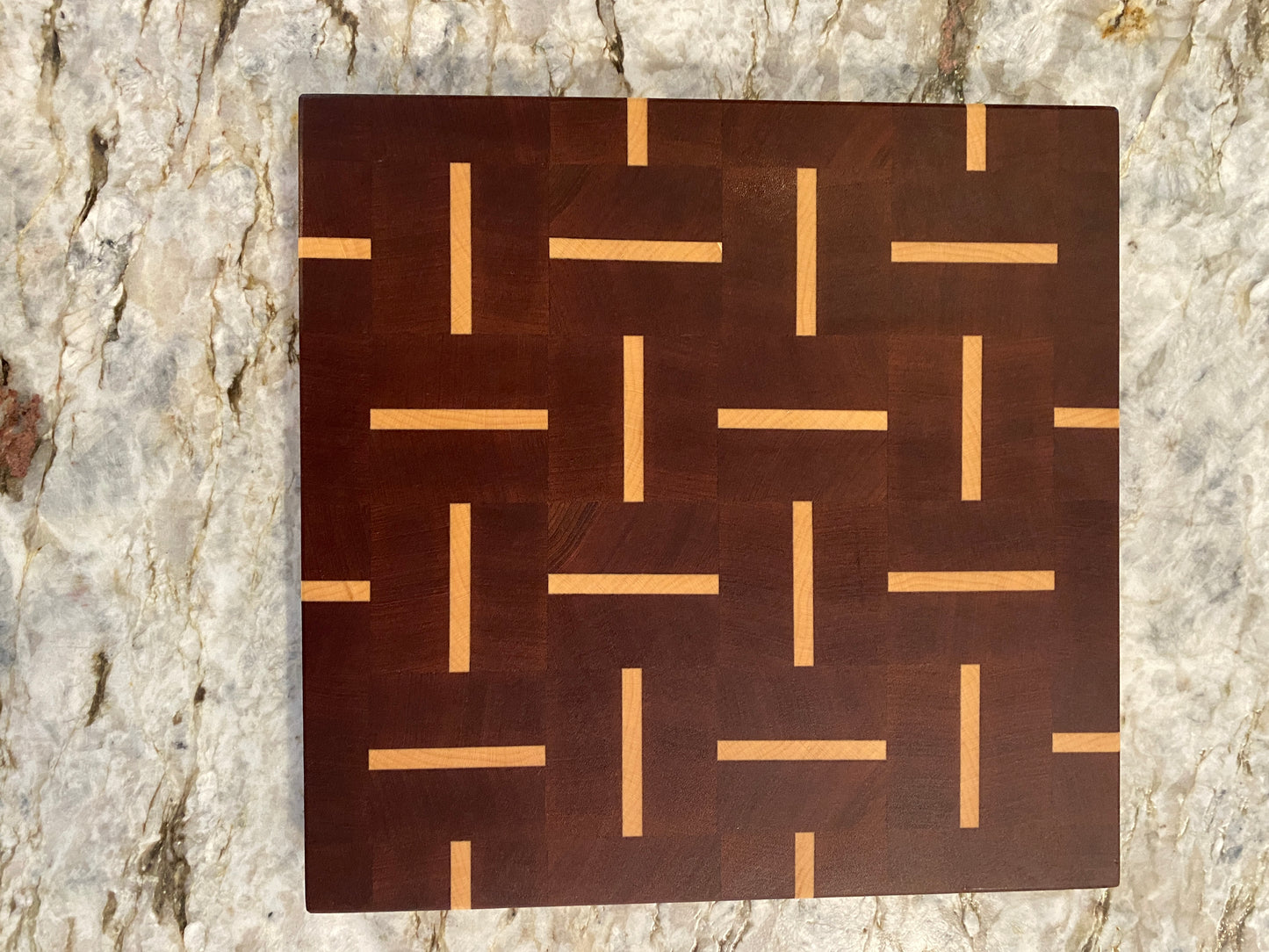 Sapelle end grain cutting board with Maple basketweave