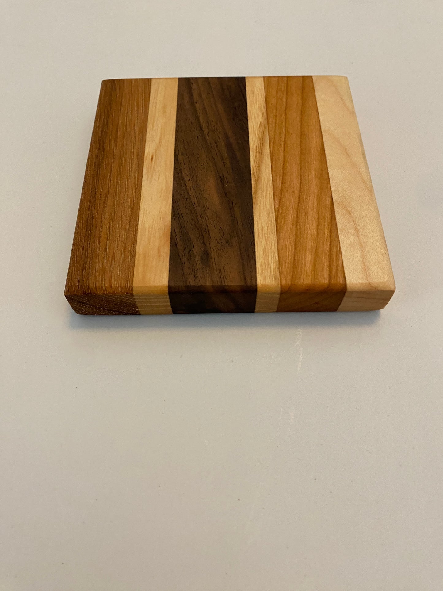 Coaster with built in bottle opener