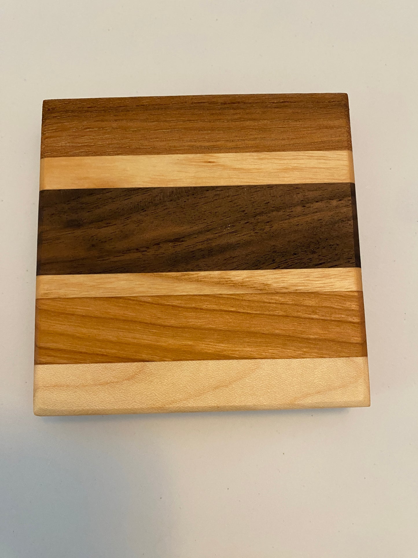 Coaster with built in bottle opener
