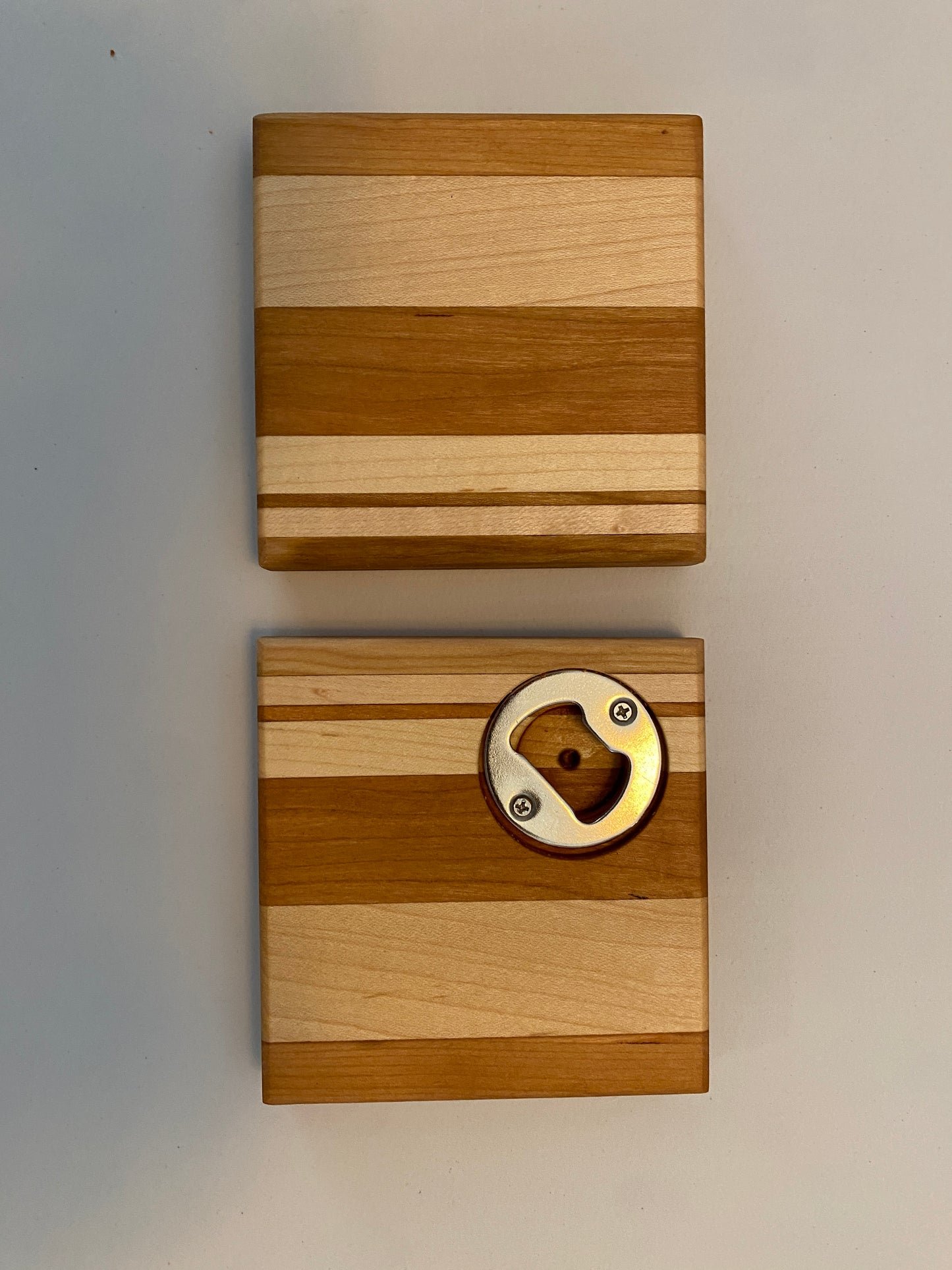 Coaster with built in bottle opener