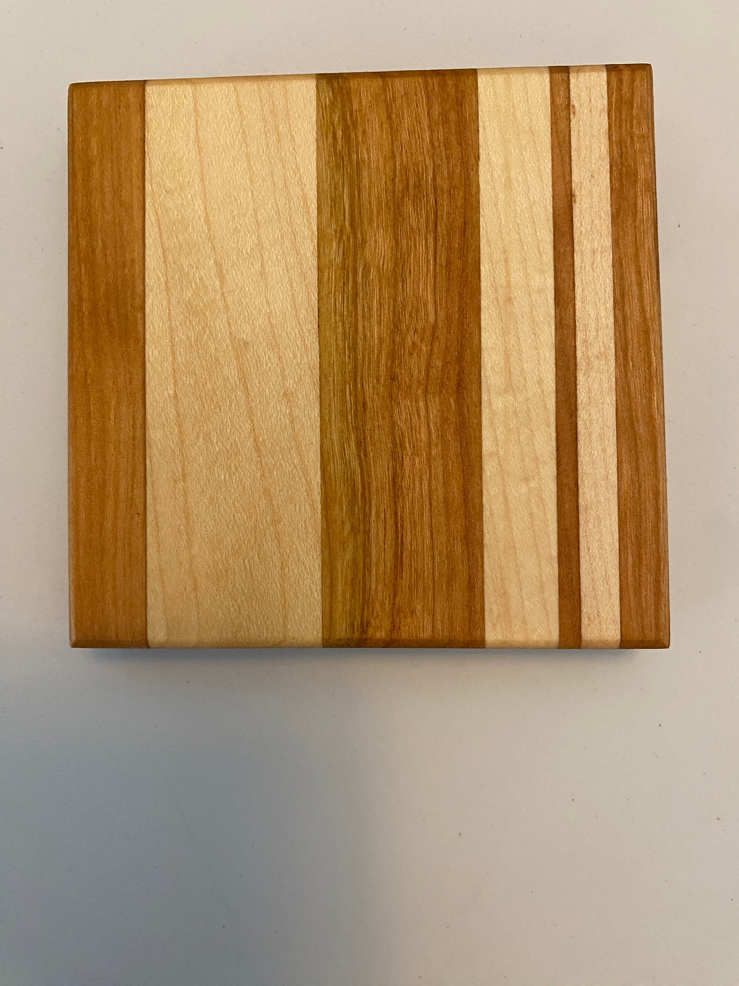 Coaster with built in bottle opener