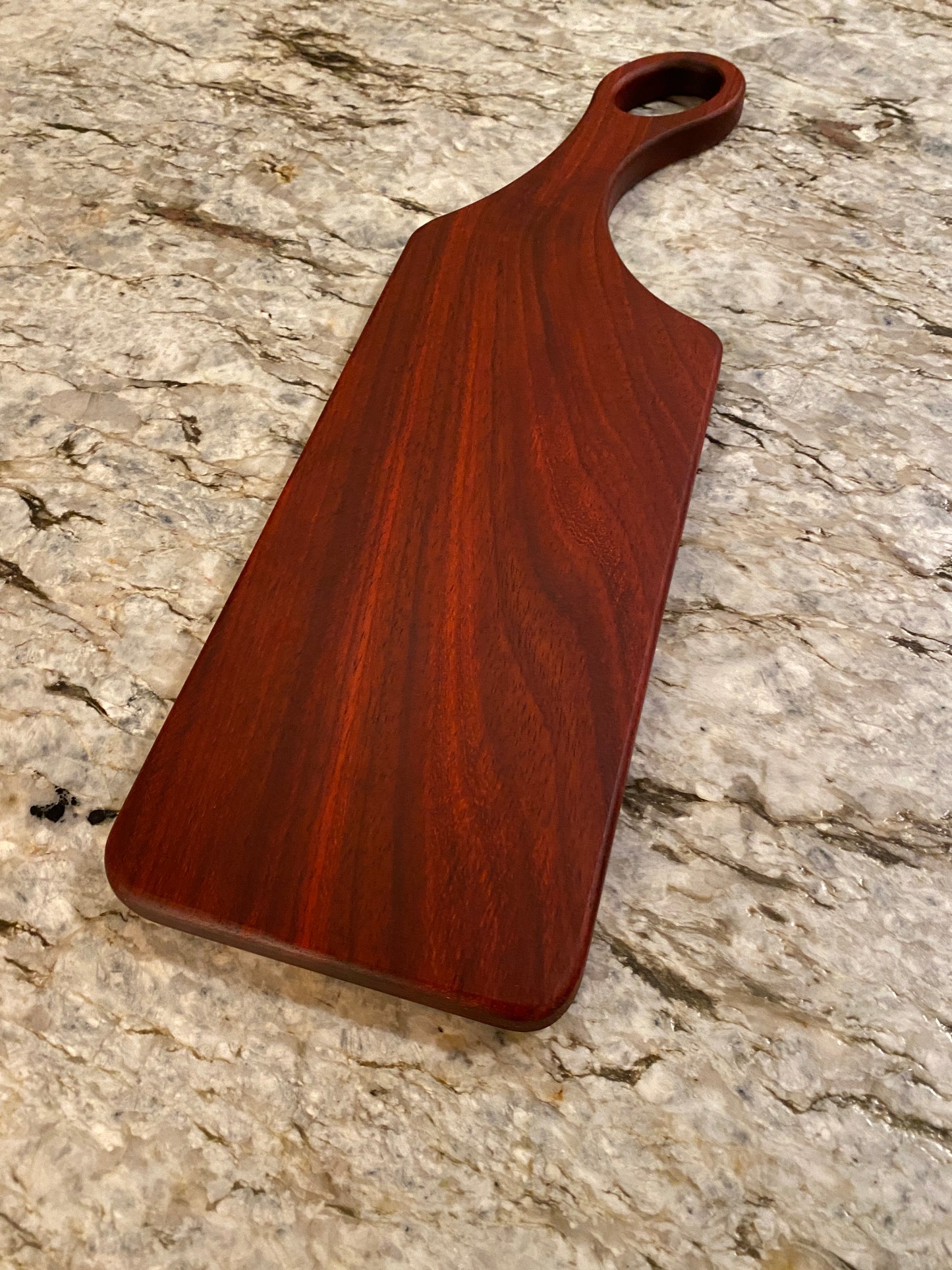 Classic Padauk charcuterie board with oval handle