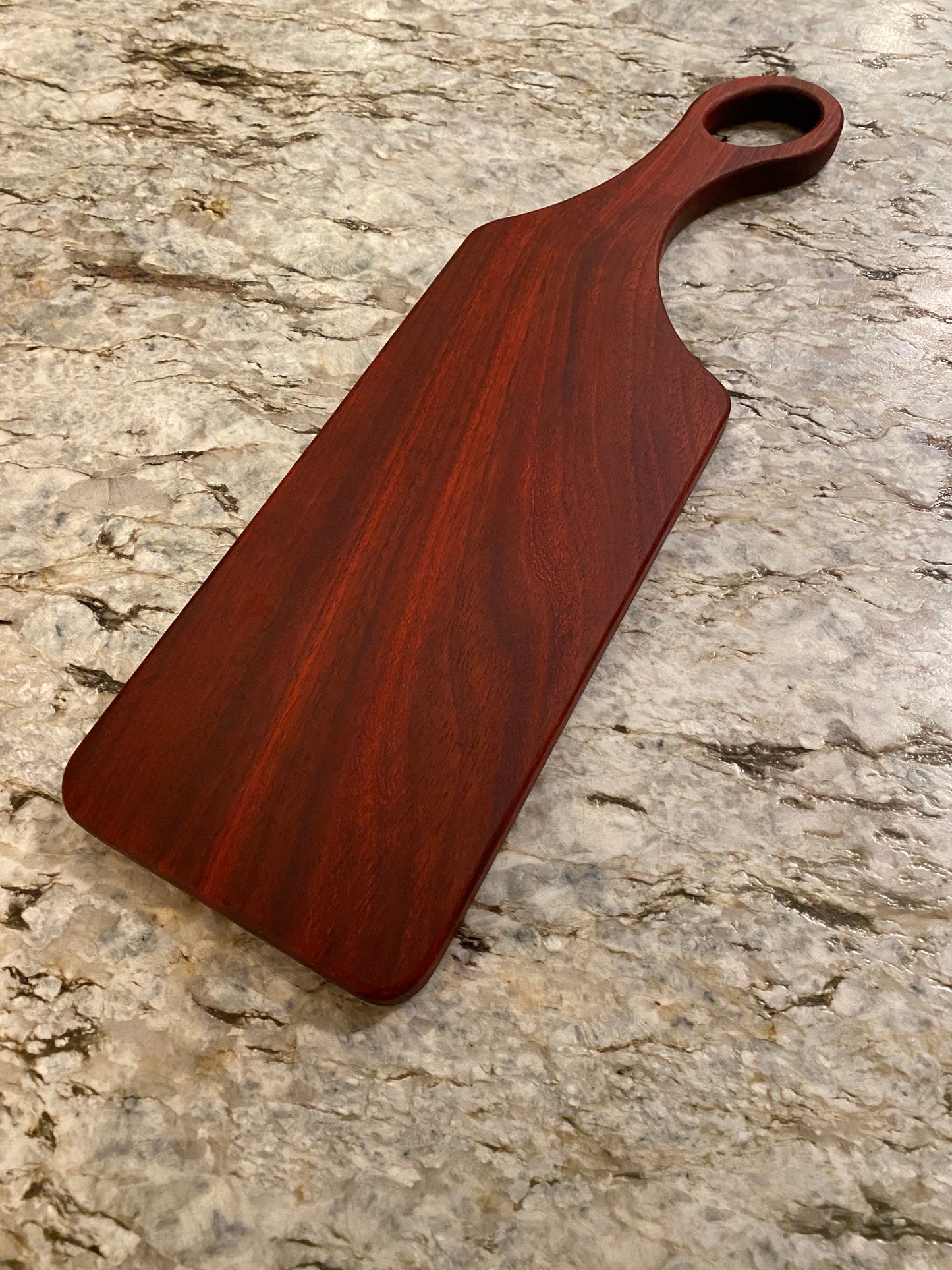 Classic Padauk charcuterie board with oval handle