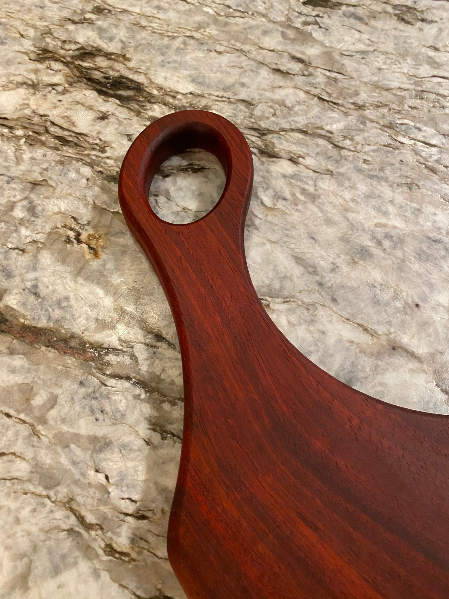 Classic Padauk charcuterie board with oval handle
