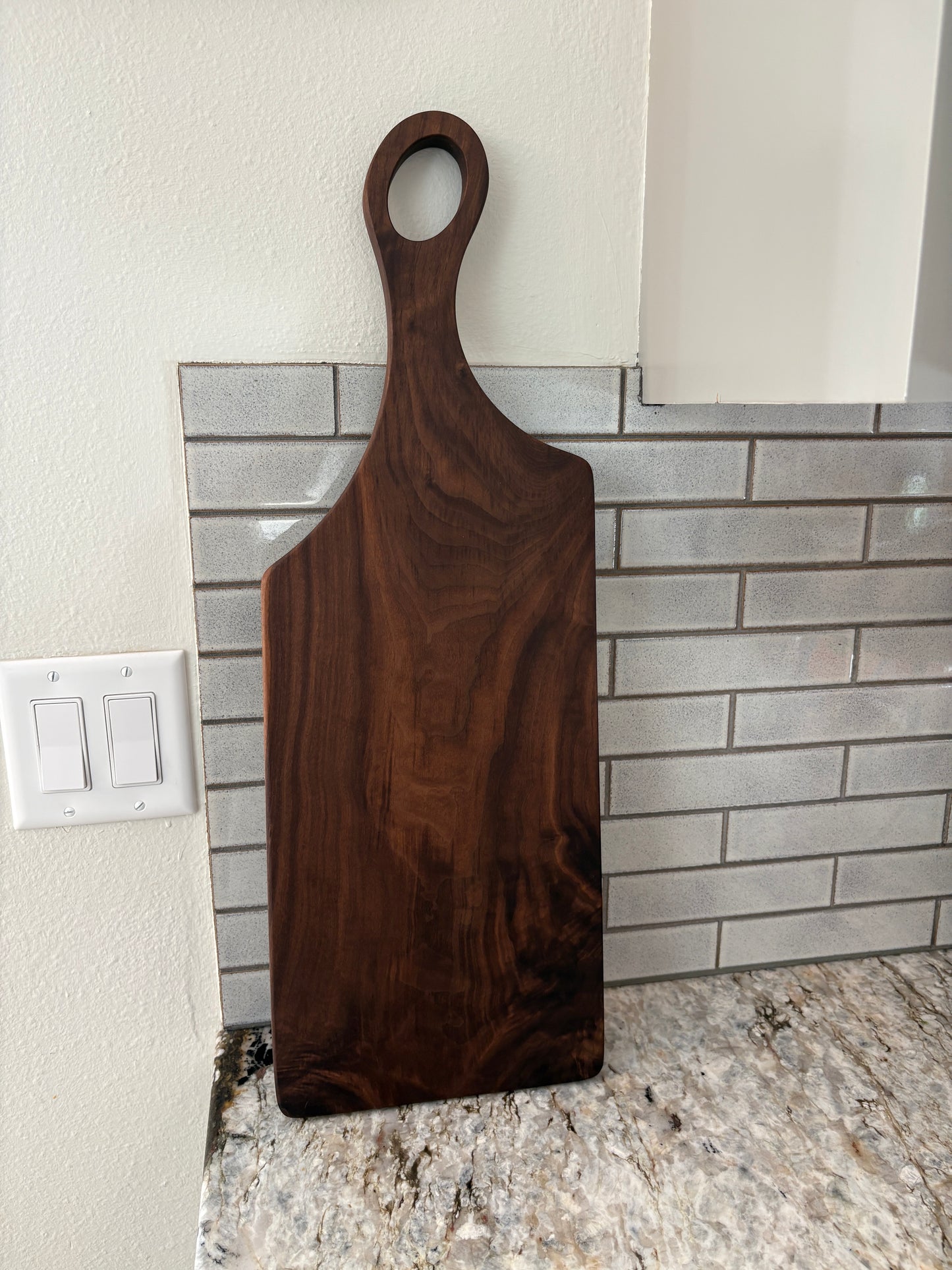 Classic figured walnut charcuterie board with handle
