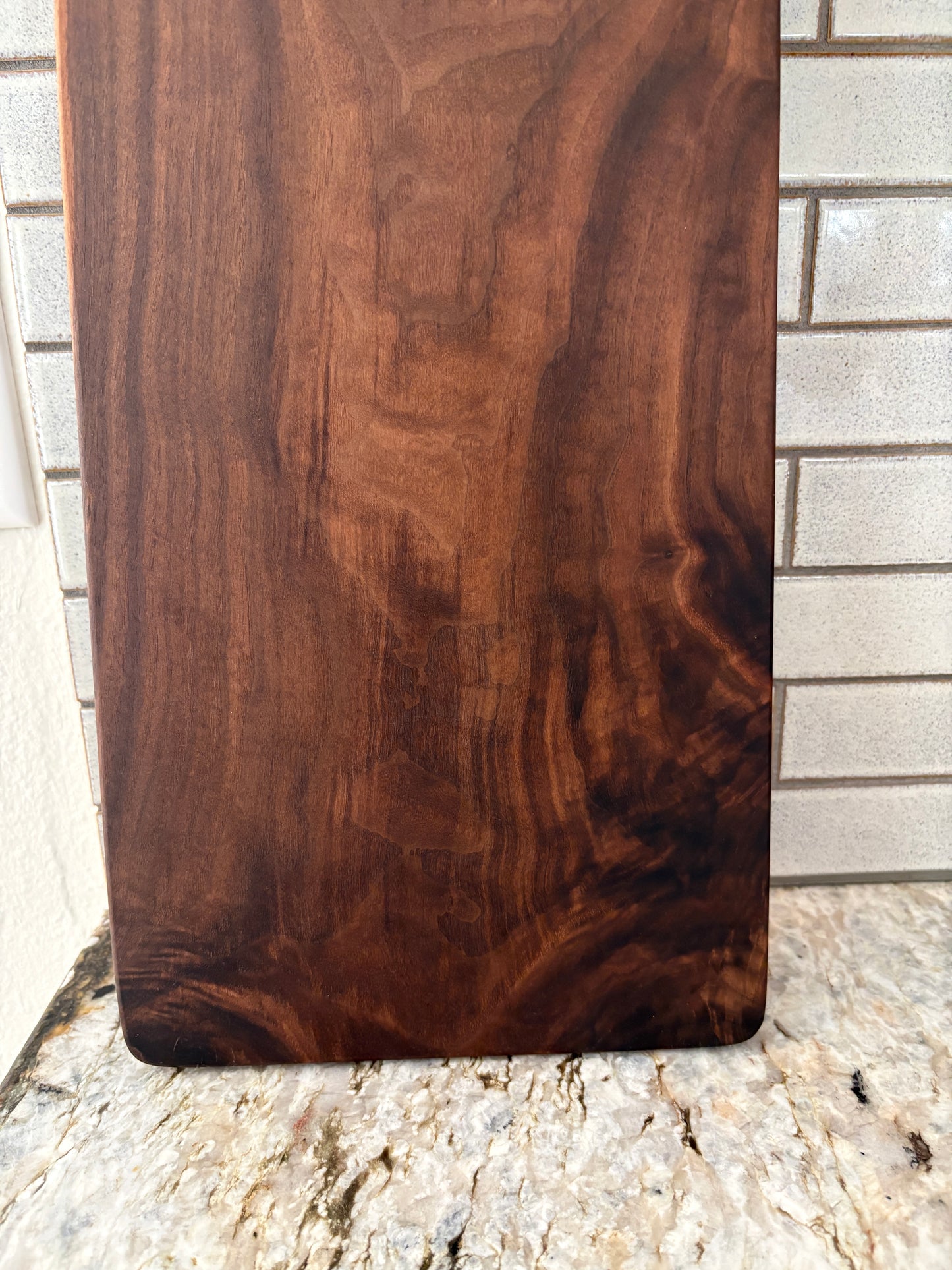 Classic figured walnut charcuterie board with handle