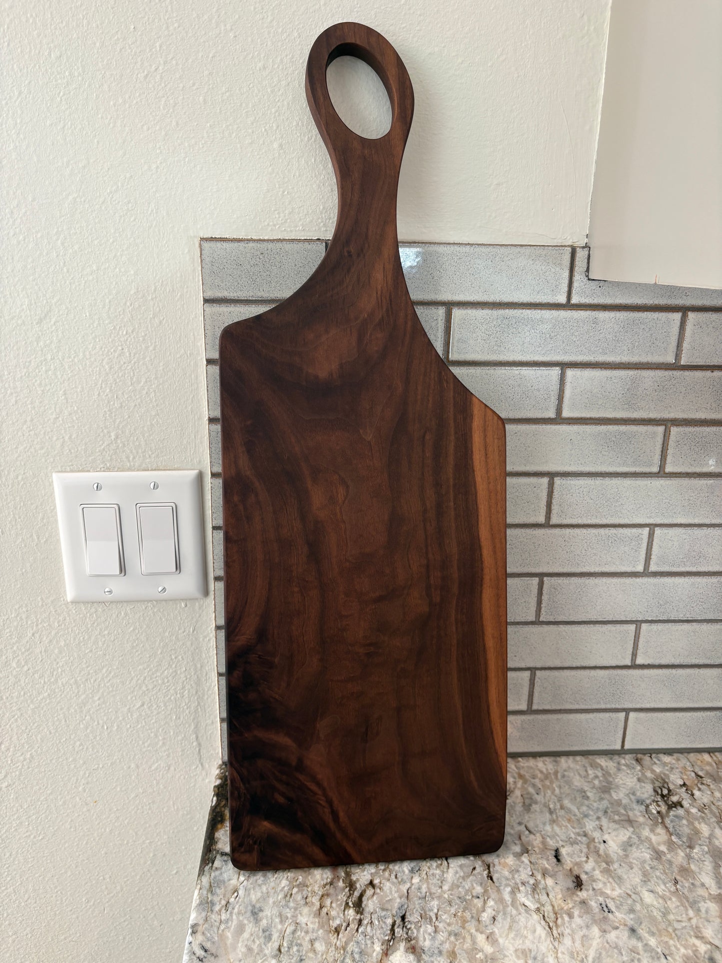 Classic figured walnut charcuterie board with handle
