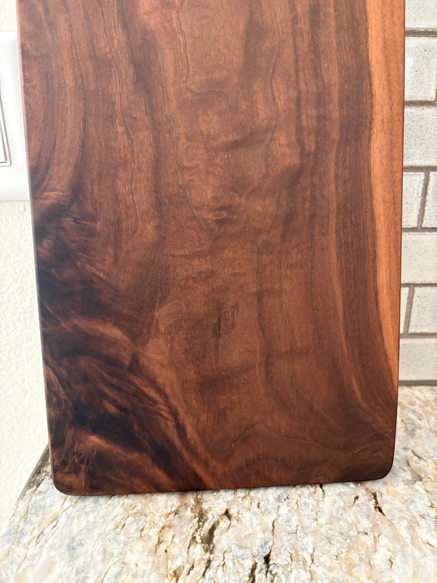 Classic figured walnut charcuterie board with handle