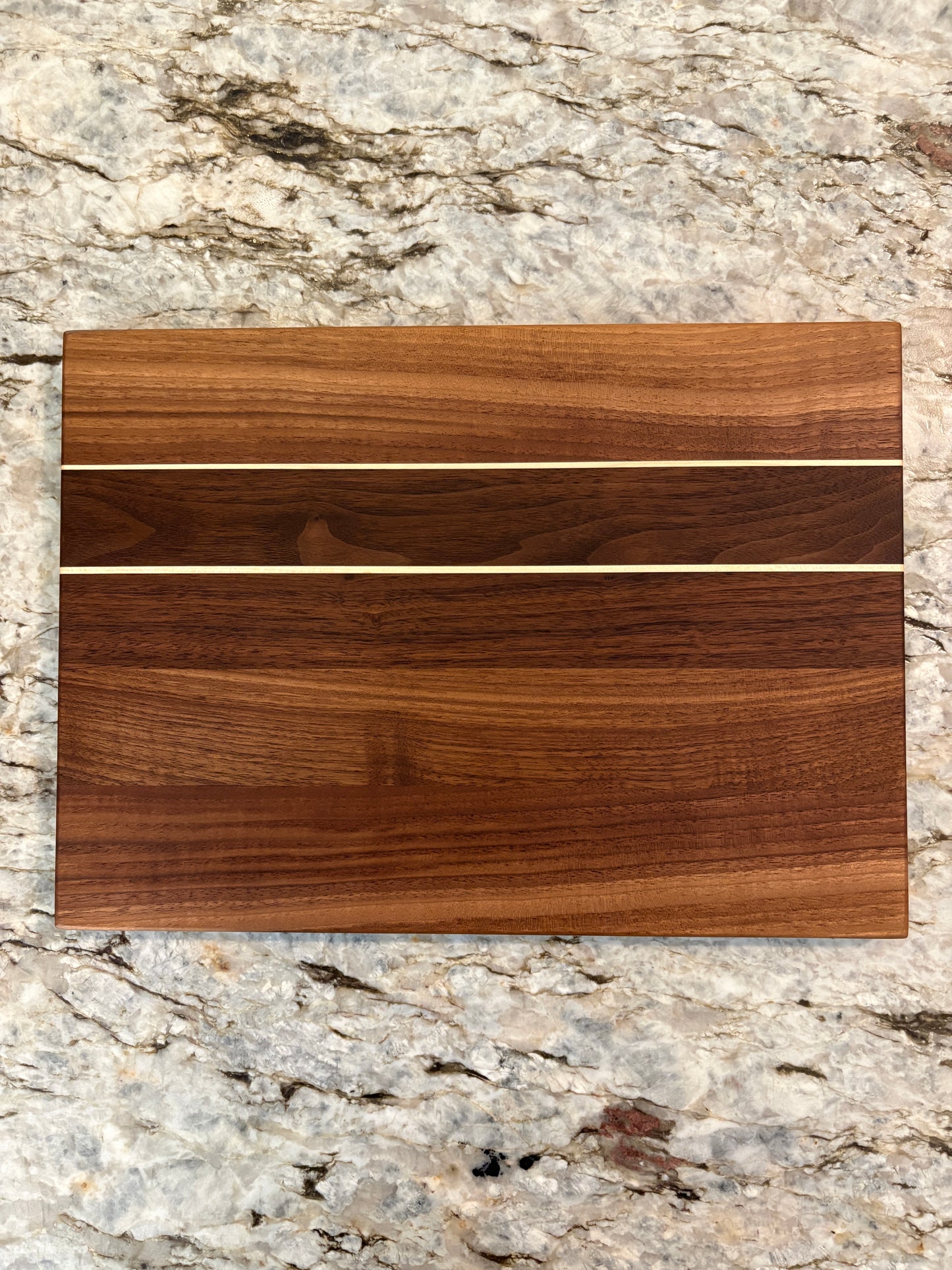 Walnut cutting board with Maple accent strips
