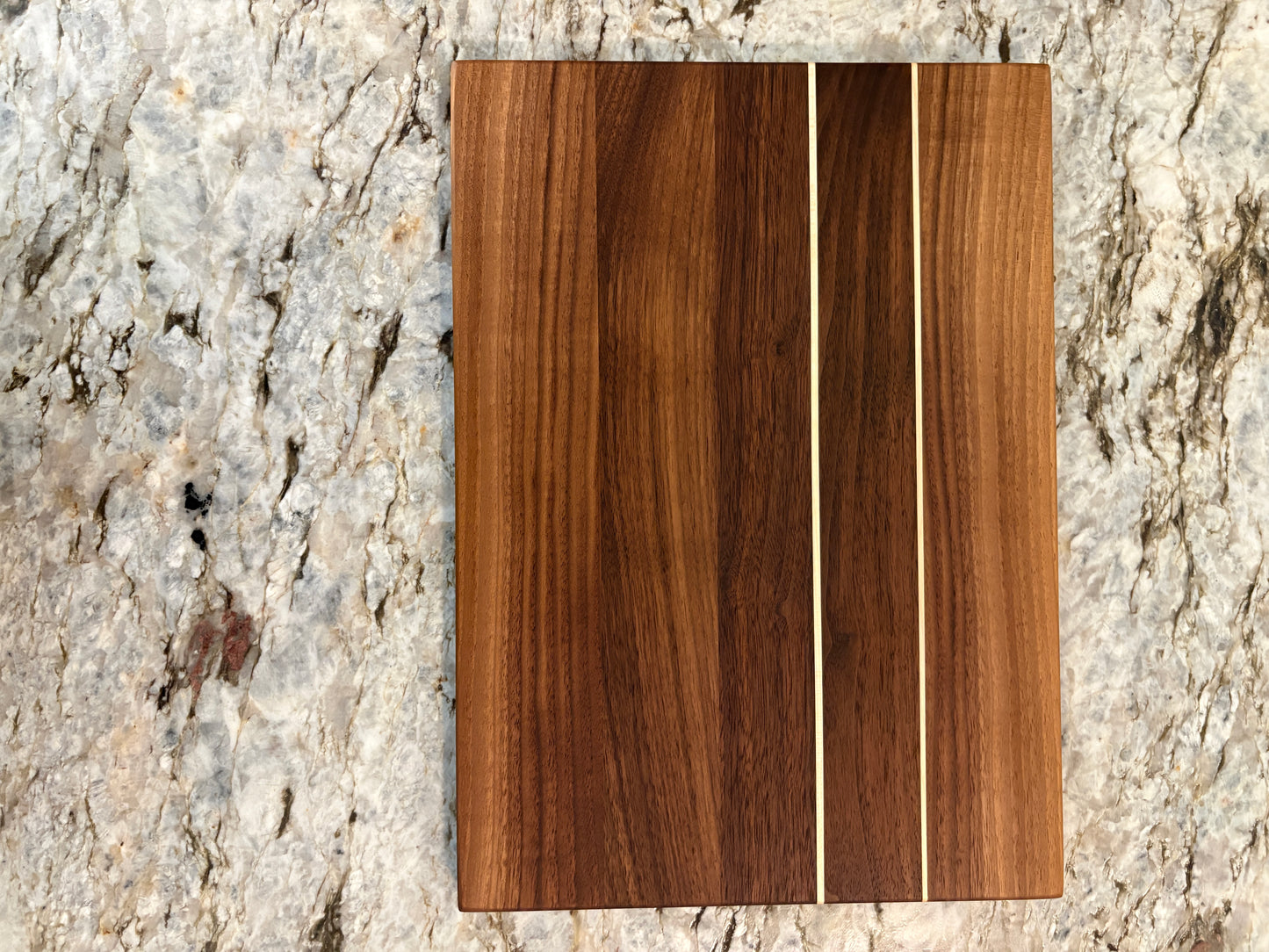 Walnut cutting board with Maple accent strips