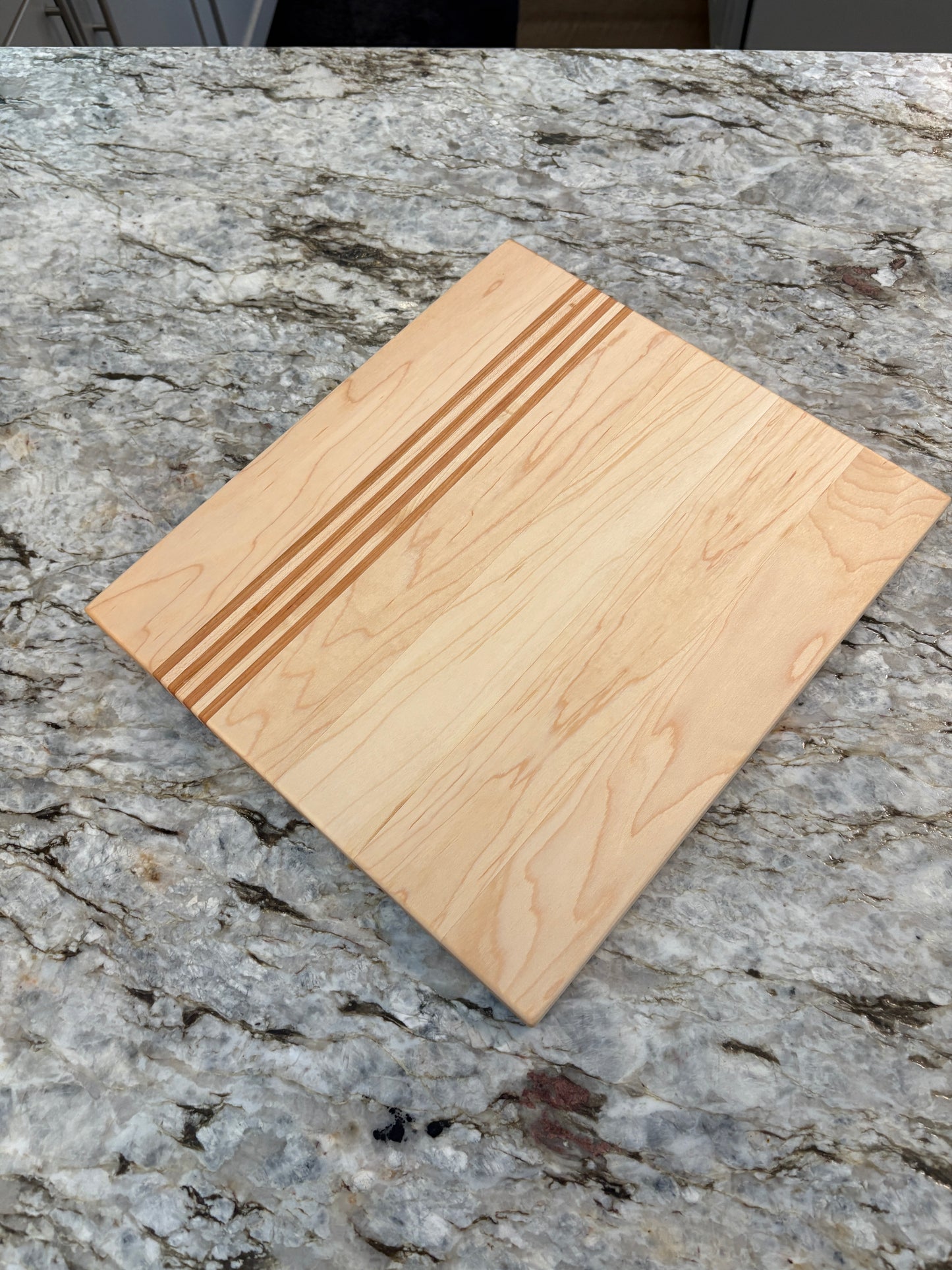 Maple cutting board with Cherry/Maple accent strips