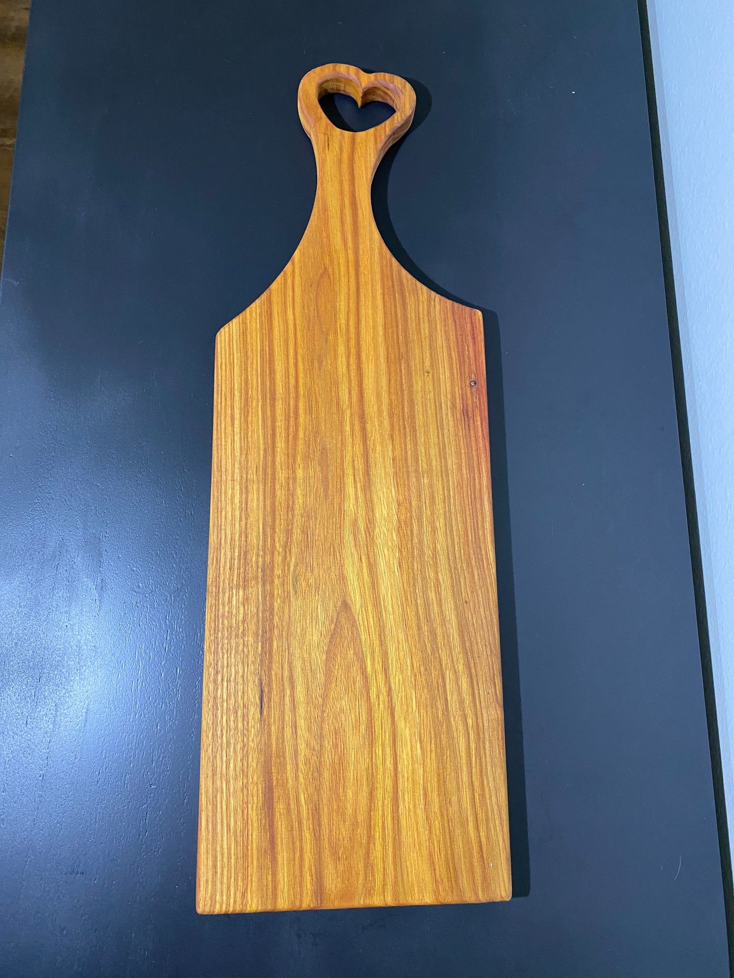 Classic canary wood charcuterie board with heart handle