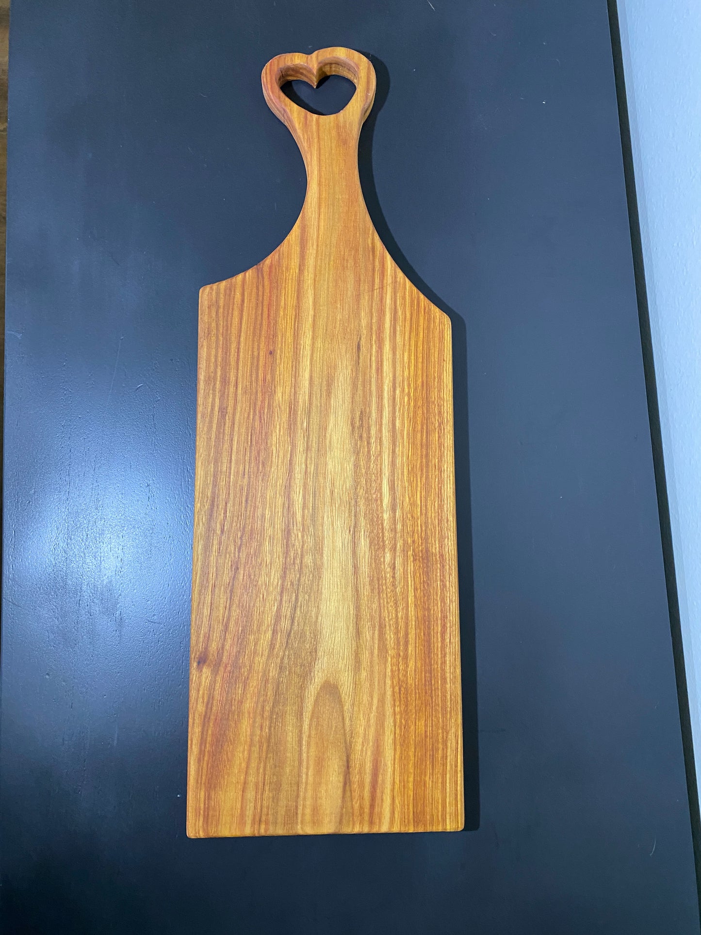 Classic canary wood charcuterie board with heart handle