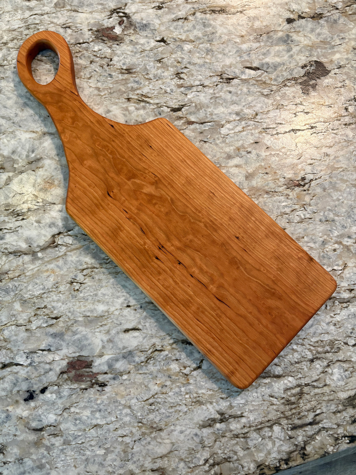Classic Cherry charcuterie board with oval handle