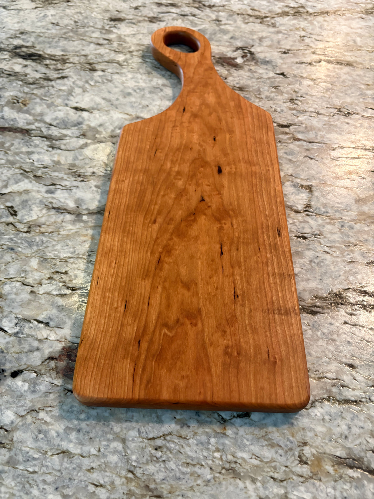 Classic Cherry charcuterie board with oval handle