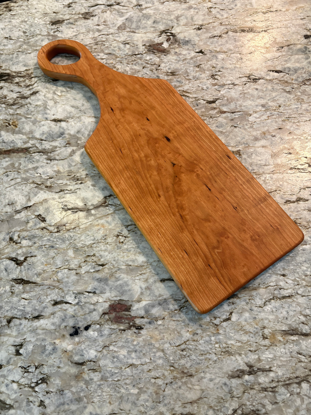 Classic Cherry charcuterie board with oval handle