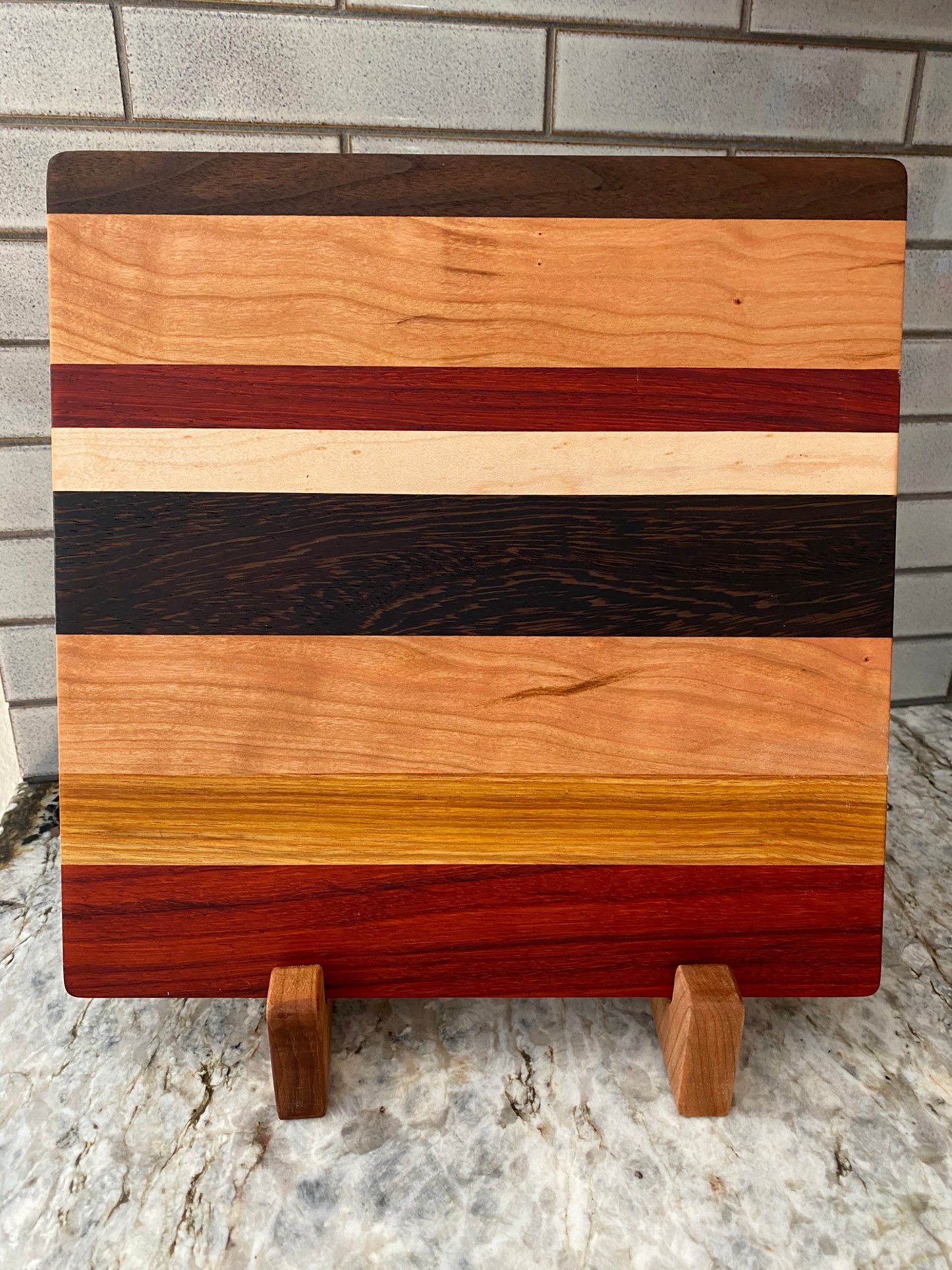 Padauk, Canary, Wenge, Birdseye Maple, Walnut, and Cherry cutting board