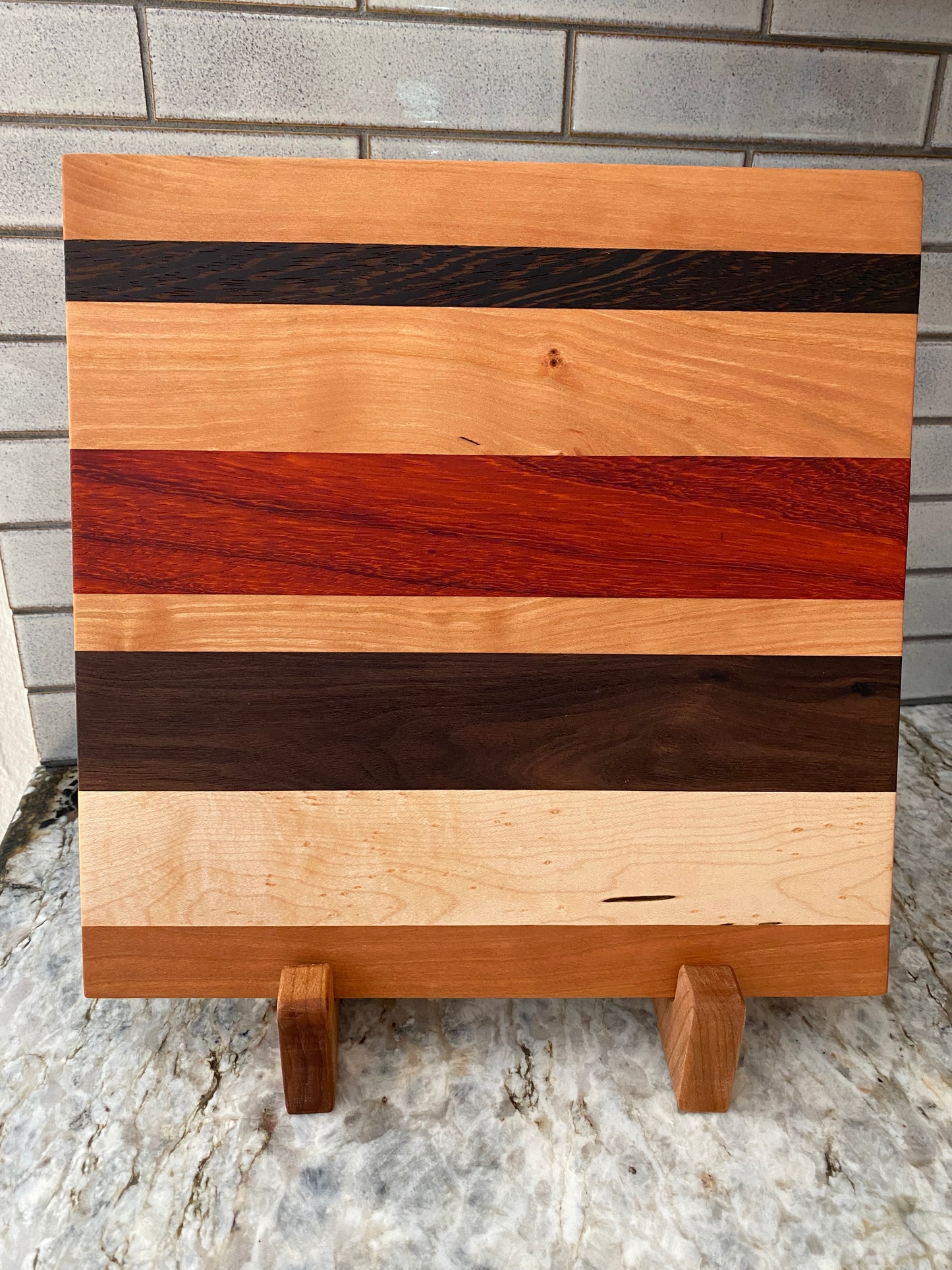 Padauk, Canary, Wenge, Birdseye Maple, Walnut, and Cherry cutting board