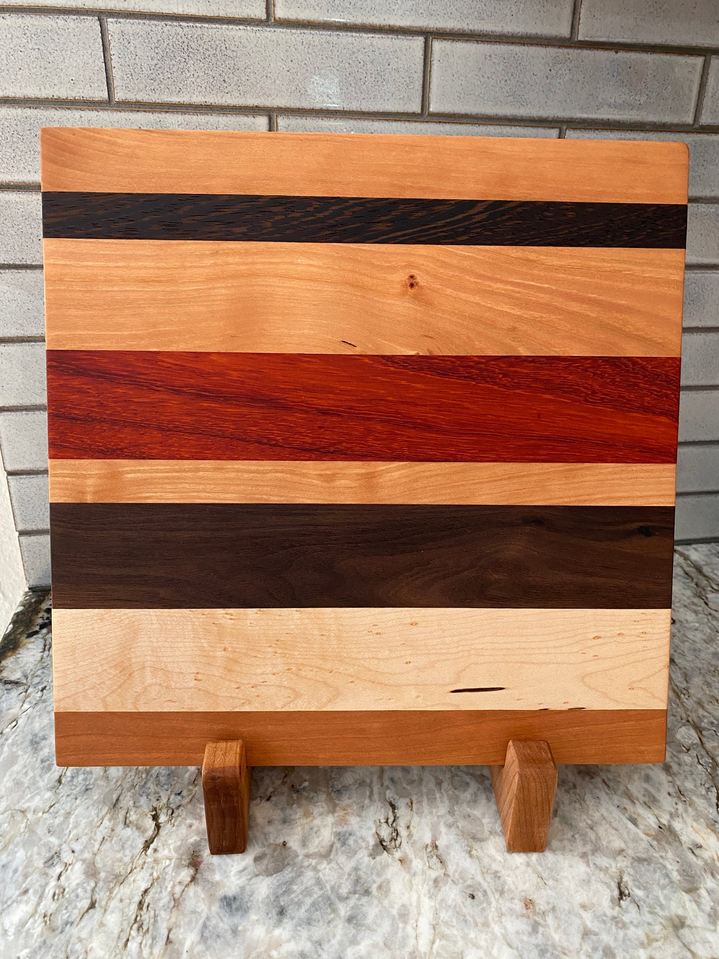 Padauk, Canary, Wenge, Birdseye Maple, Walnut, and Cherry cutting board