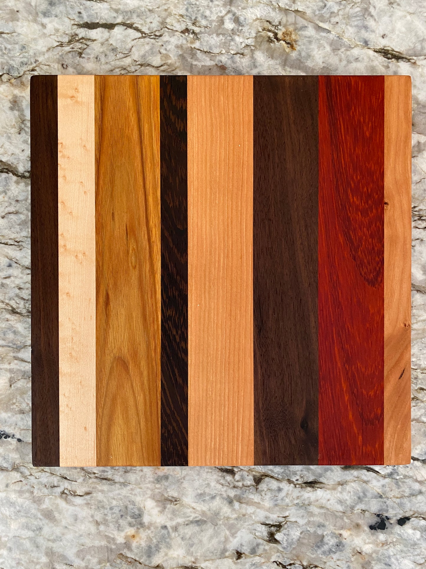 Padauk, Canary, Wenge, Birdseye Maple, Walnut, and Cherry cutting board