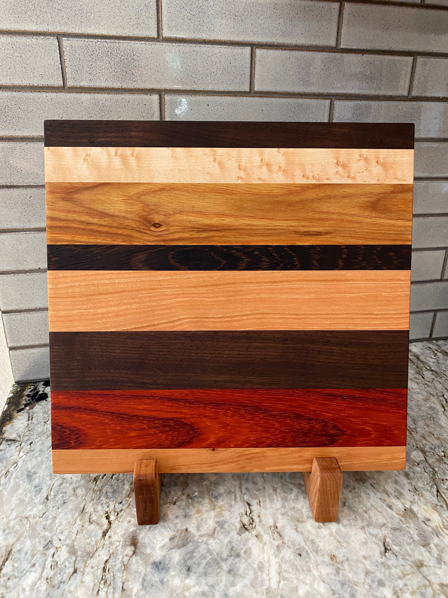 Padauk, Canary, Wenge, Birdseye Maple, Walnut, and Cherry cutting board