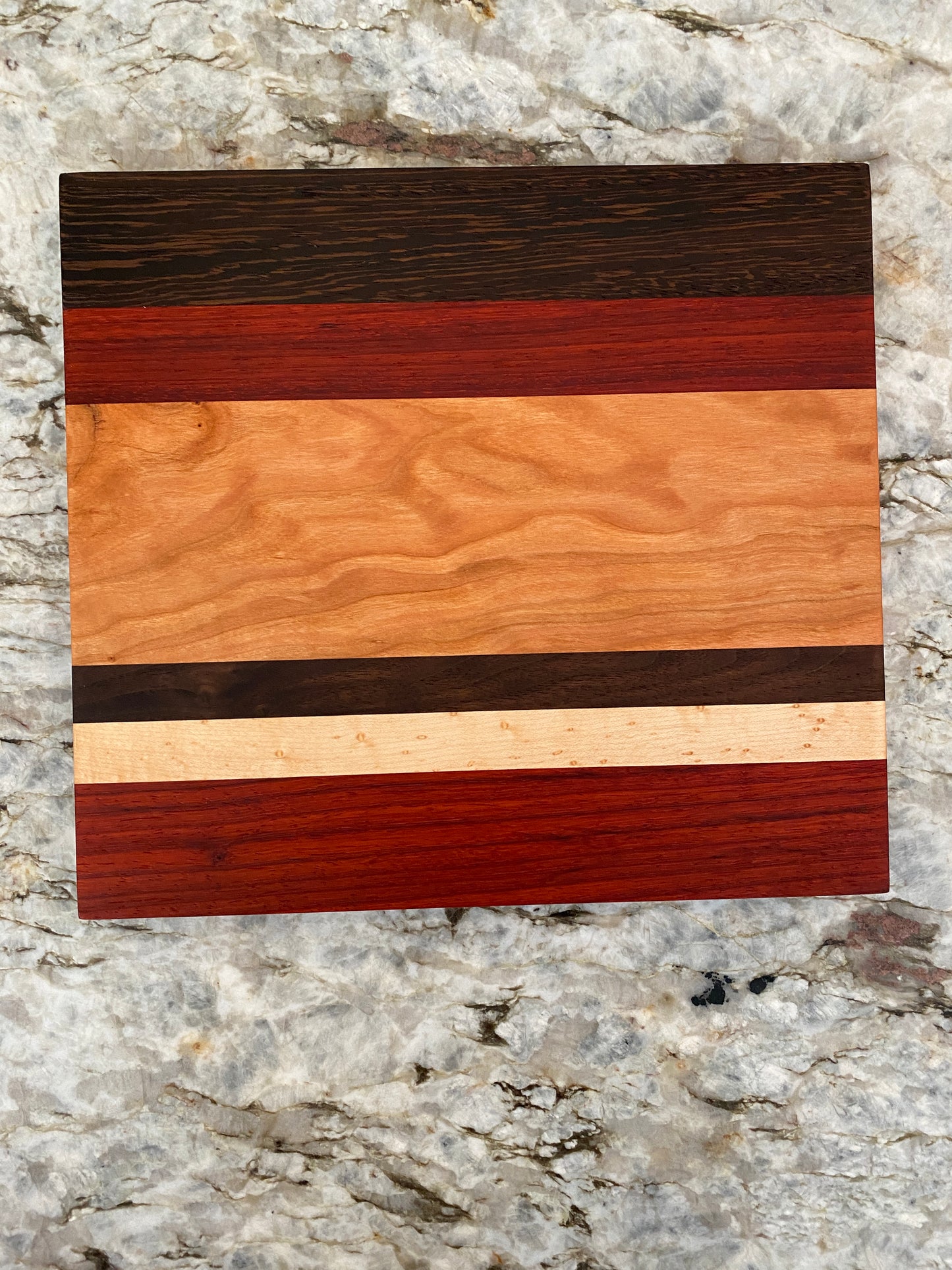 Padauk, Wenge, Birdseye Maple, Walnut, and Cherry cutting board