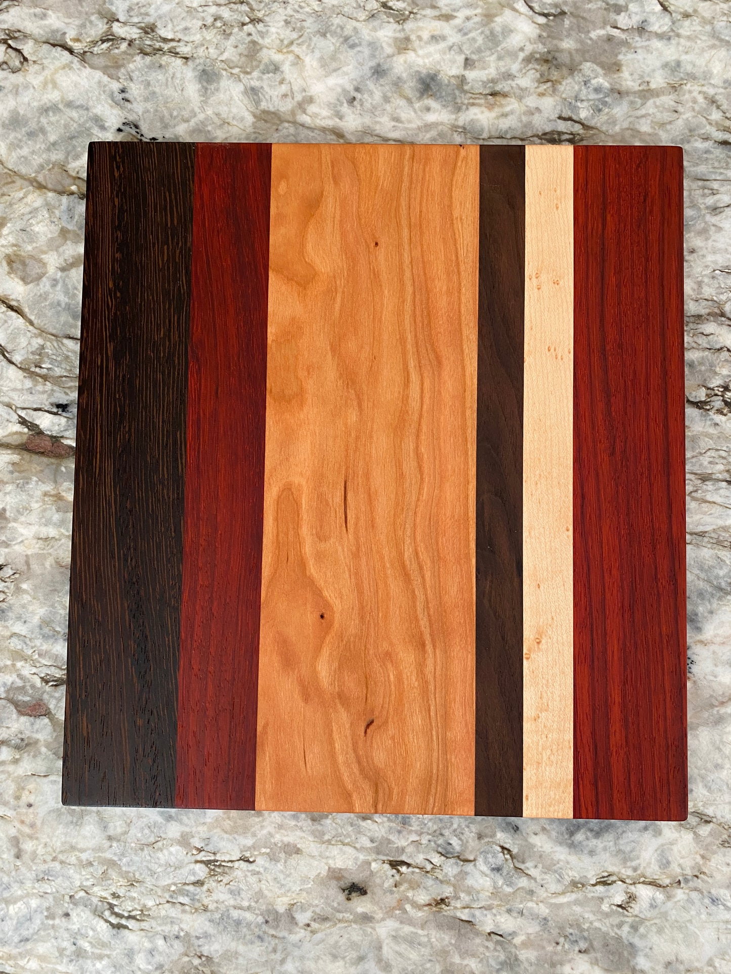 Padauk, Wenge, Birdseye Maple, Walnut, and Cherry cutting board