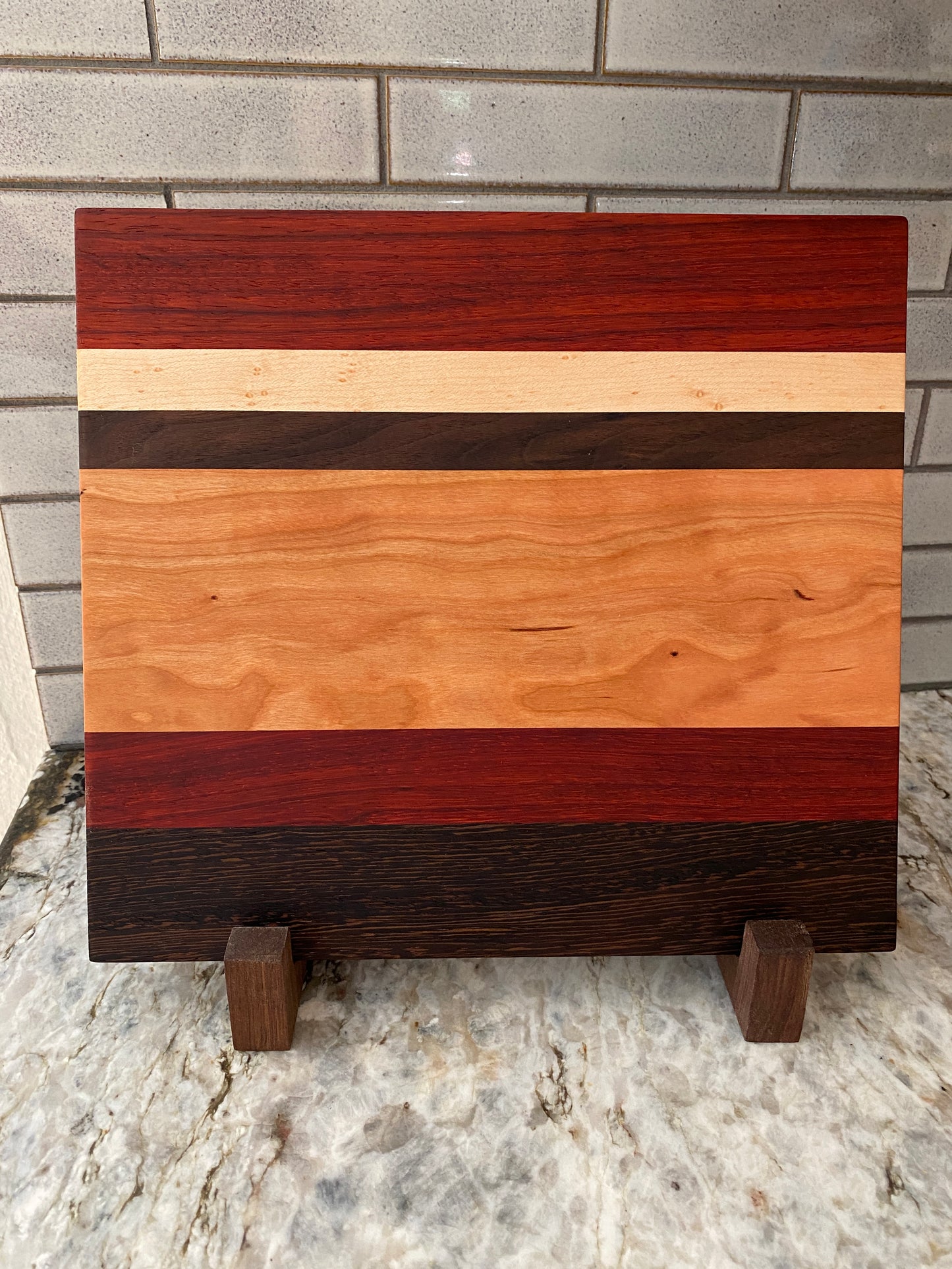 Padauk, Wenge, Birdseye Maple, Walnut, and Cherry cutting board