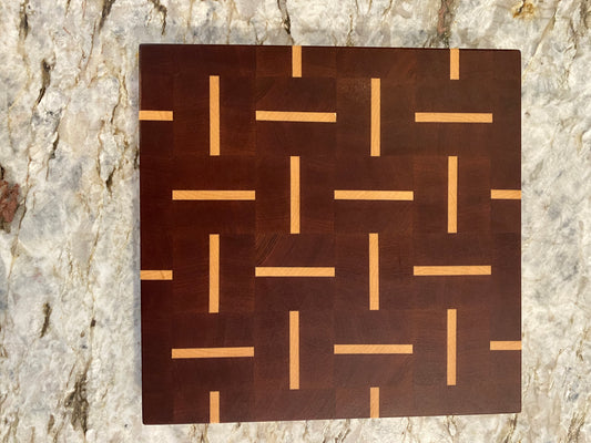 Sapelle end grain cutting board with Maple basketweave