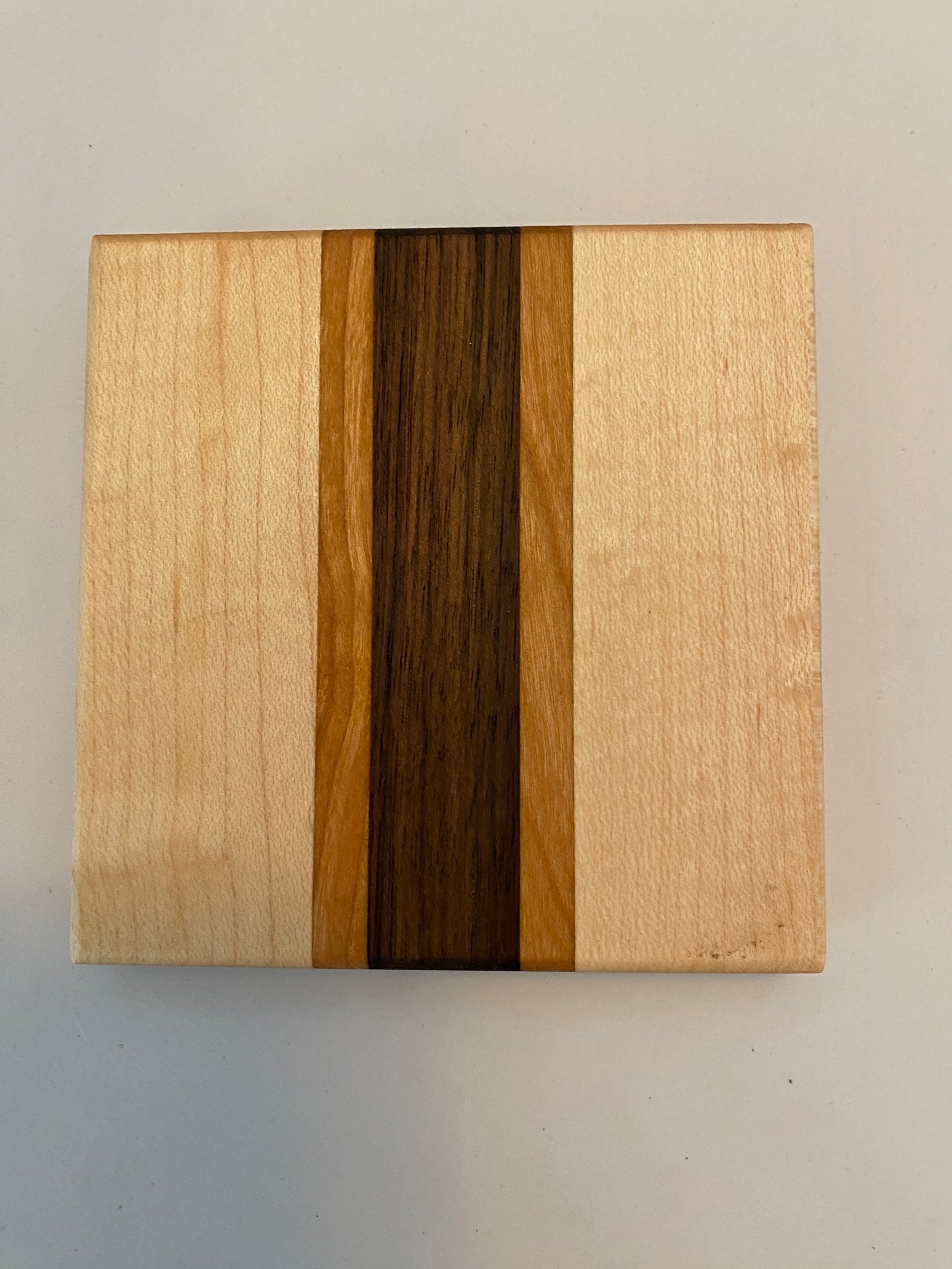 Coaster with built in bottle opener