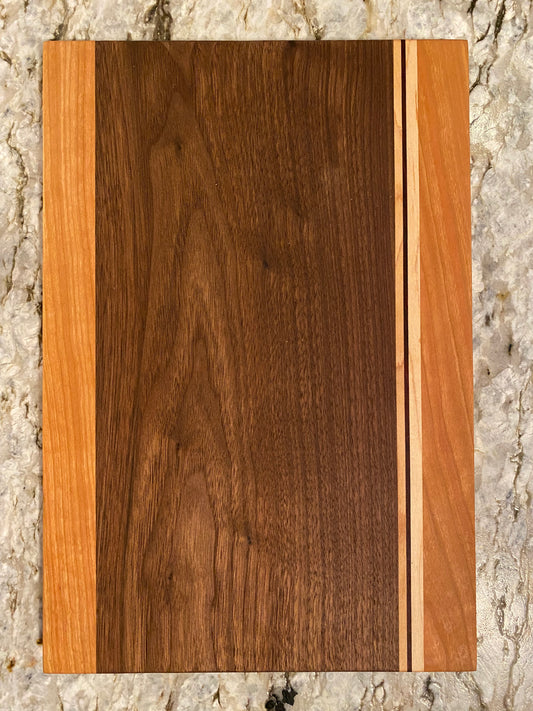 Walnut cutting board with Cherry, Maple, and Padauk highlights