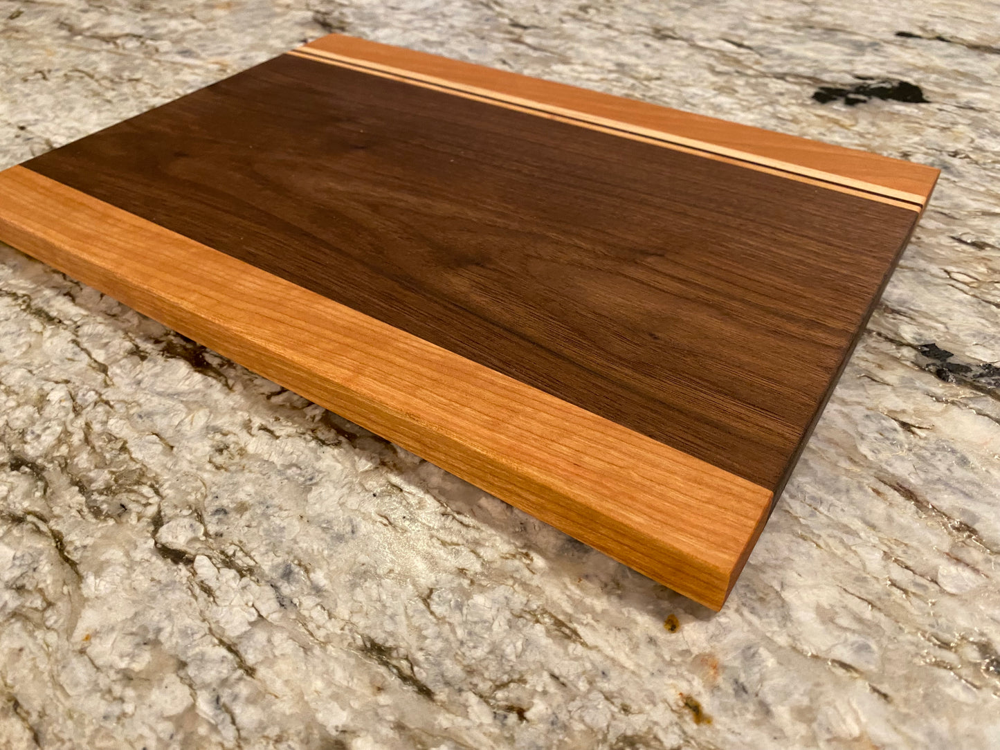 Walnut cutting board with Cherry, Maple, and Padauk highlights