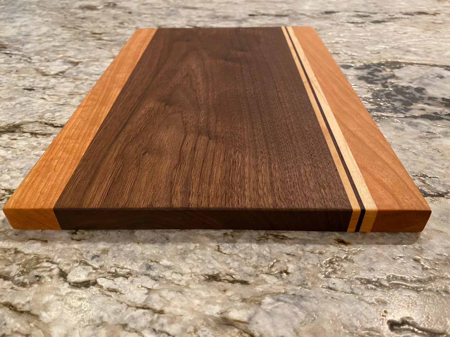 Walnut cutting board with Cherry, Maple, and Padauk highlights