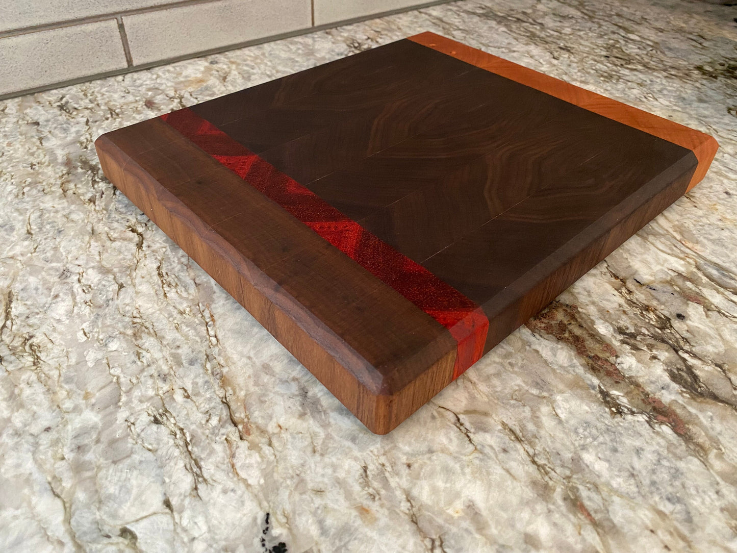 Walnut end grain cutting board/chopping block with Cherry and Padauk highlights